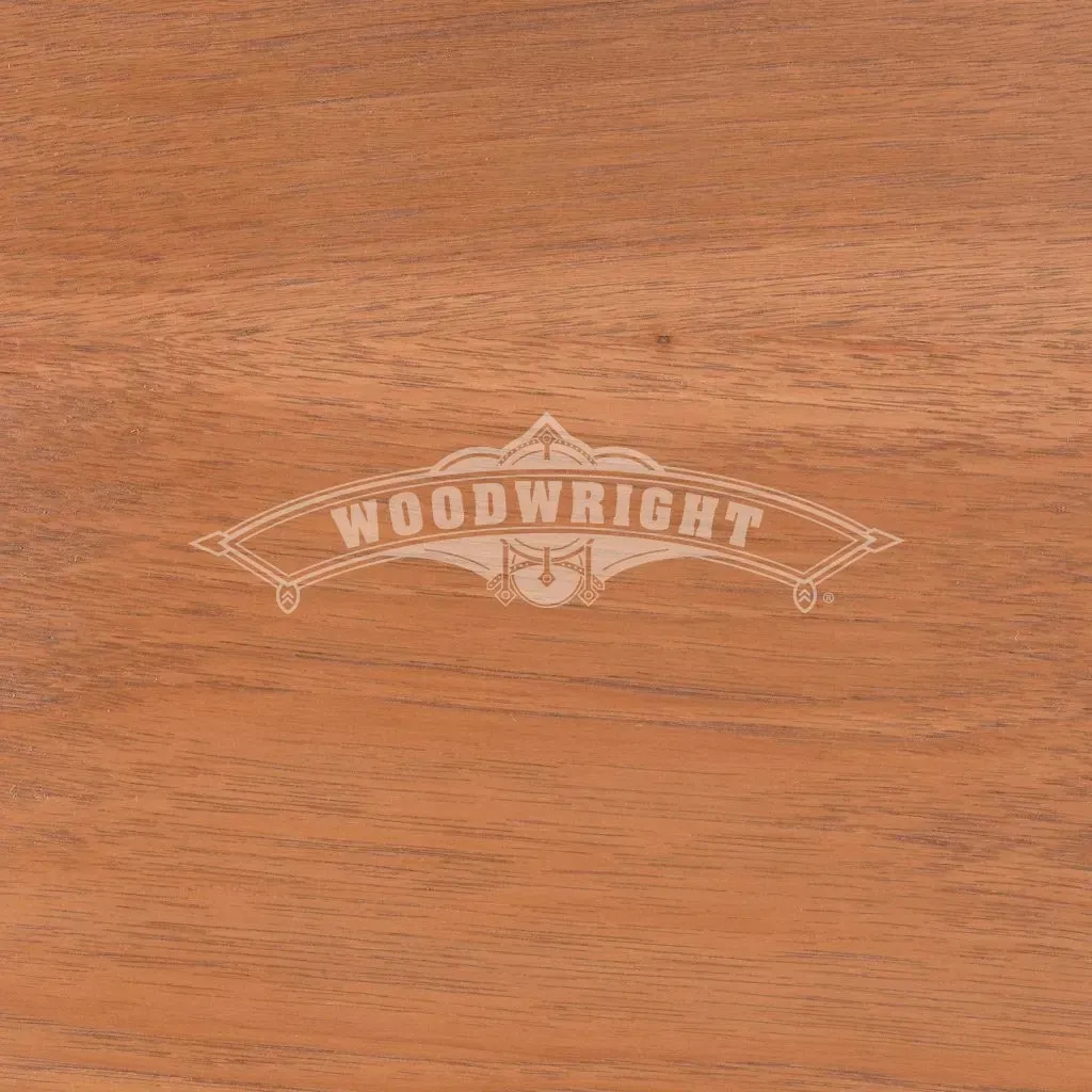 Close-up of reddish-brown wood grain with the word 