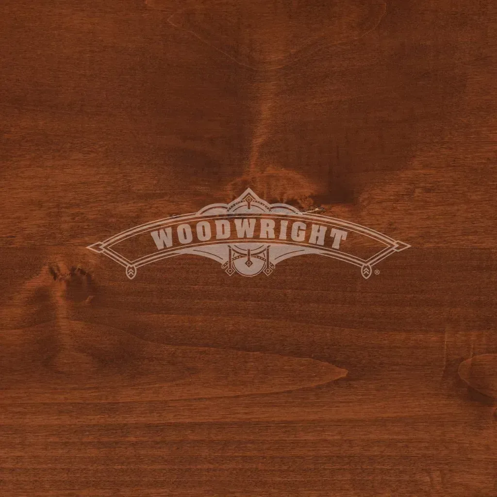 Woodwright logo on stained wood background. Brown tones.