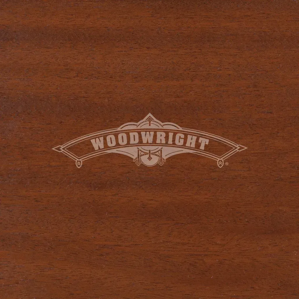Woodwright logo on a dark brown wood grain surface.