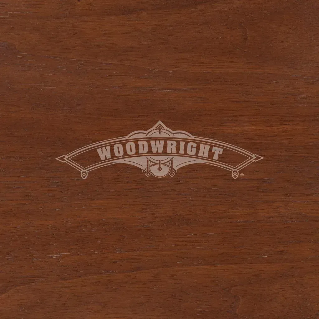 Woodwright logo on brown wood grain background.