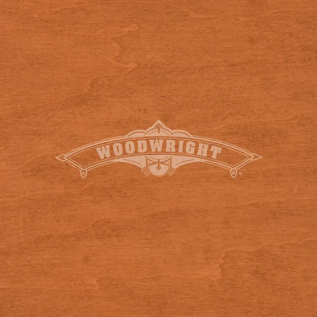Woodwright logo on orange-brown wood background.