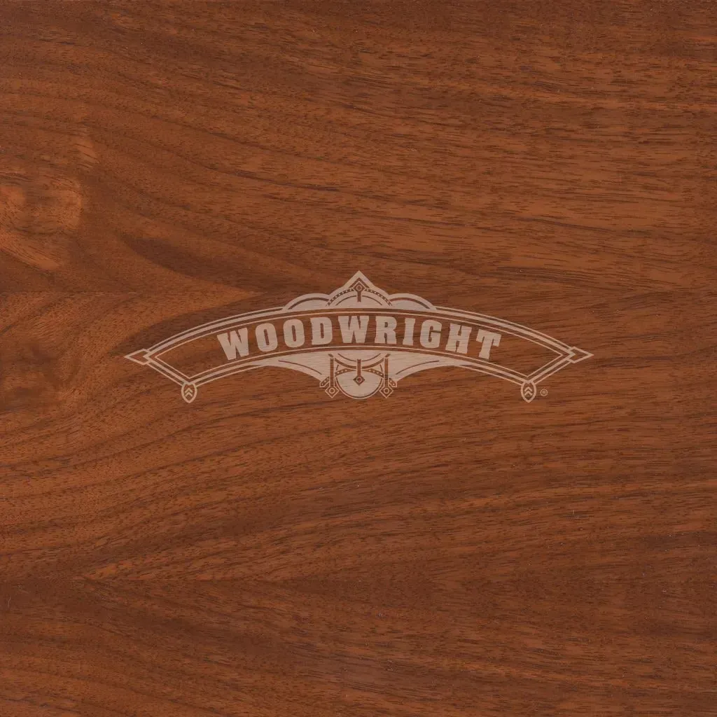 Woodwright logo on a woodgrain background. The logo is a light color.