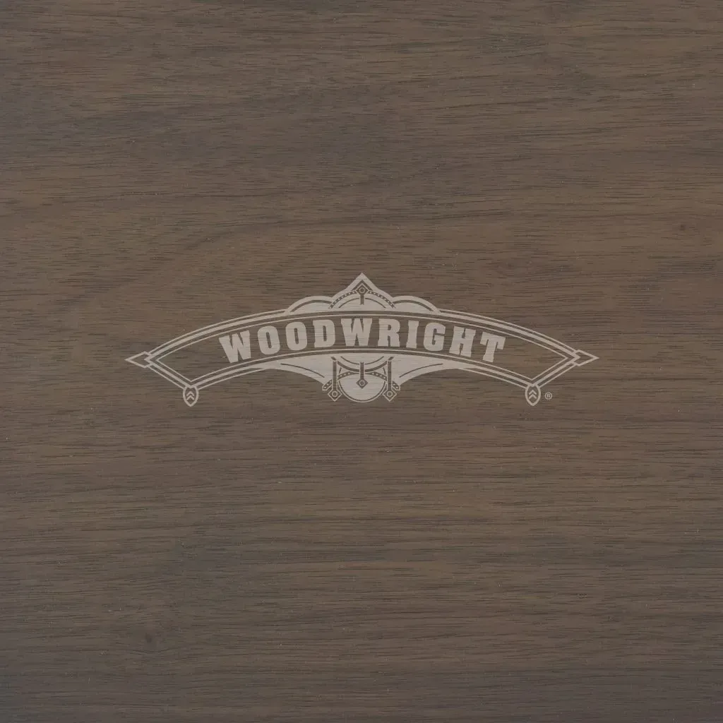 Woodwright logo on a dark wood surface.