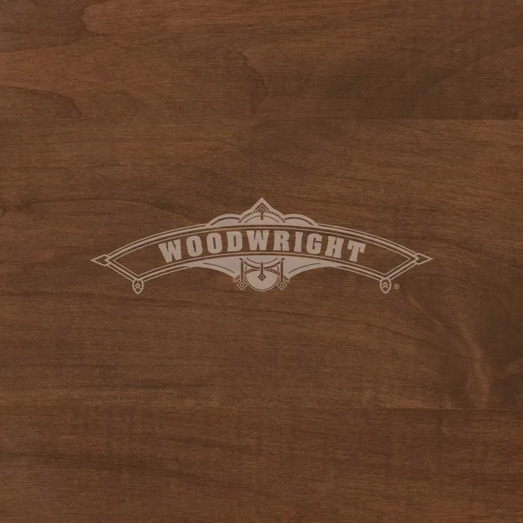 Woodwright logo on a dark wood grain background.