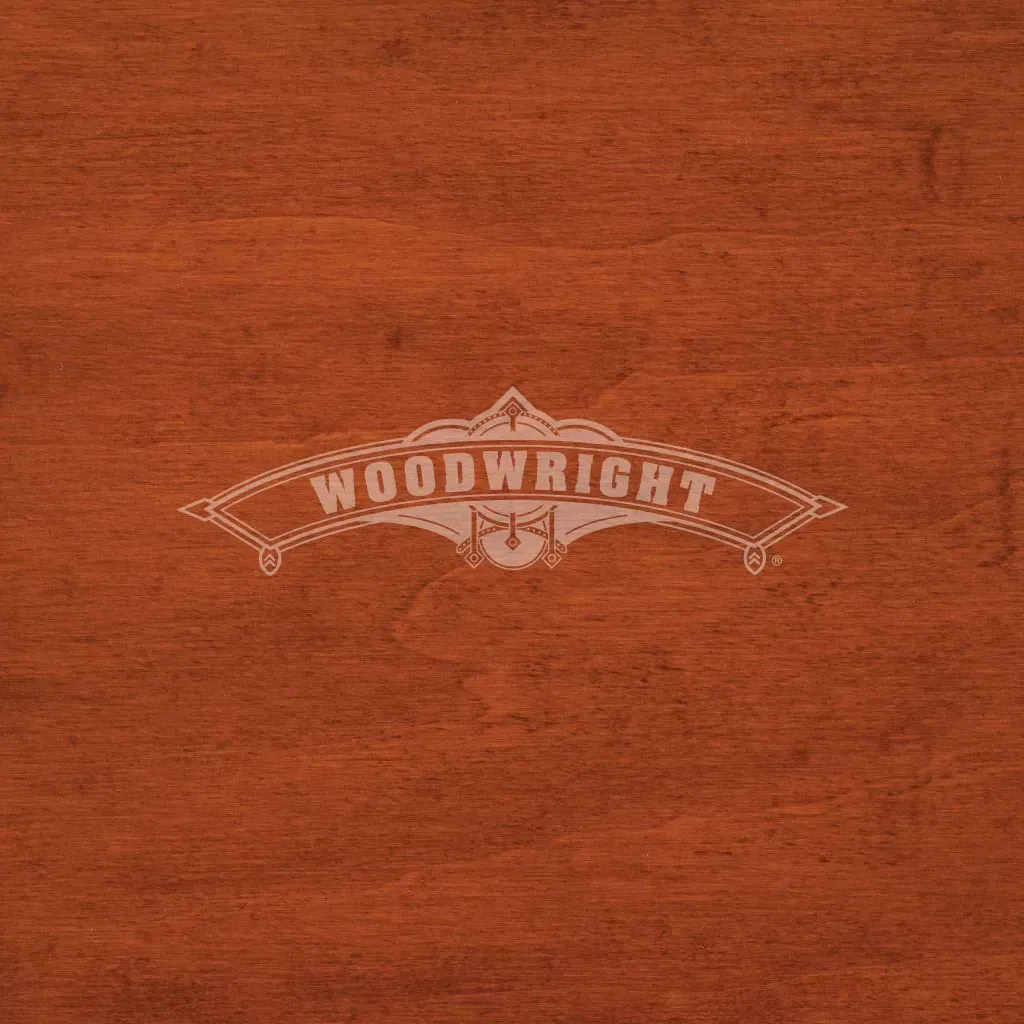 Woodwright logo on a reddish-brown wooden surface.
