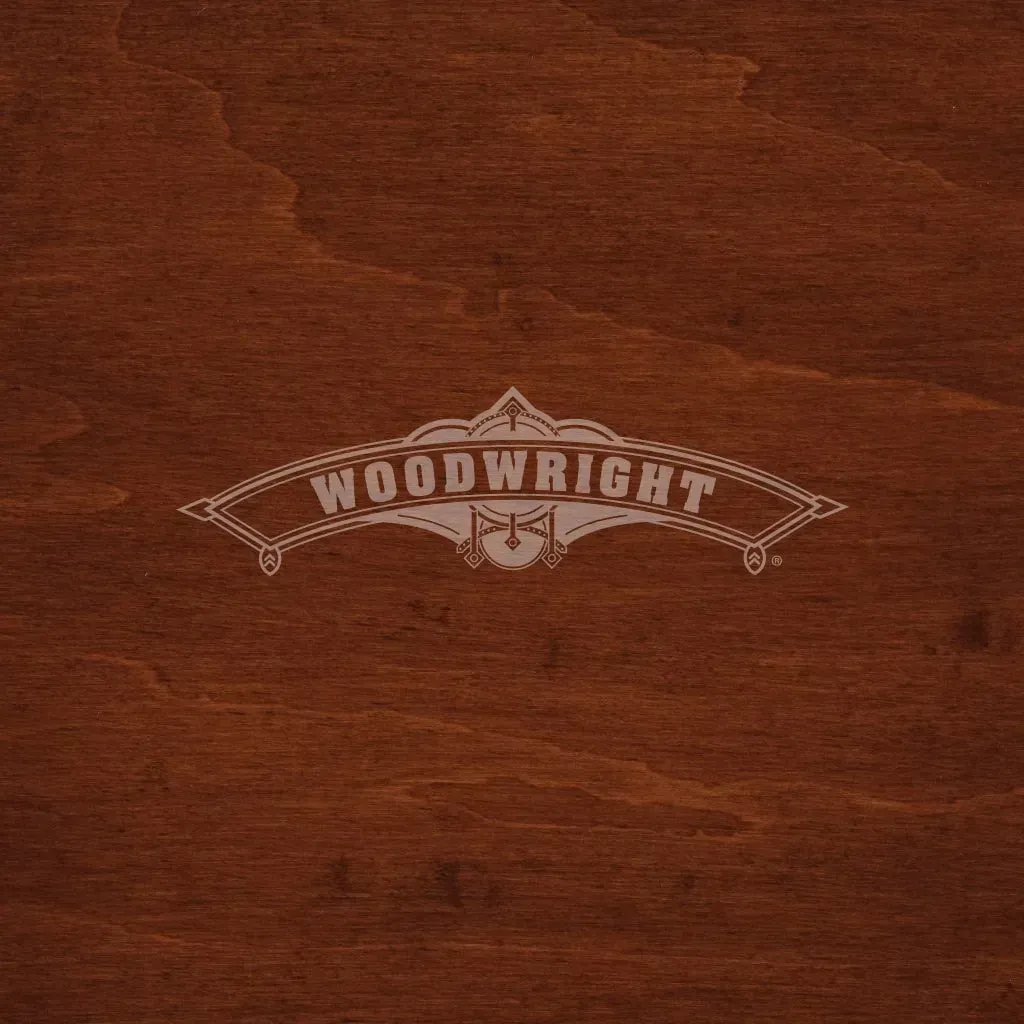Woodwright logo on a dark wood background.