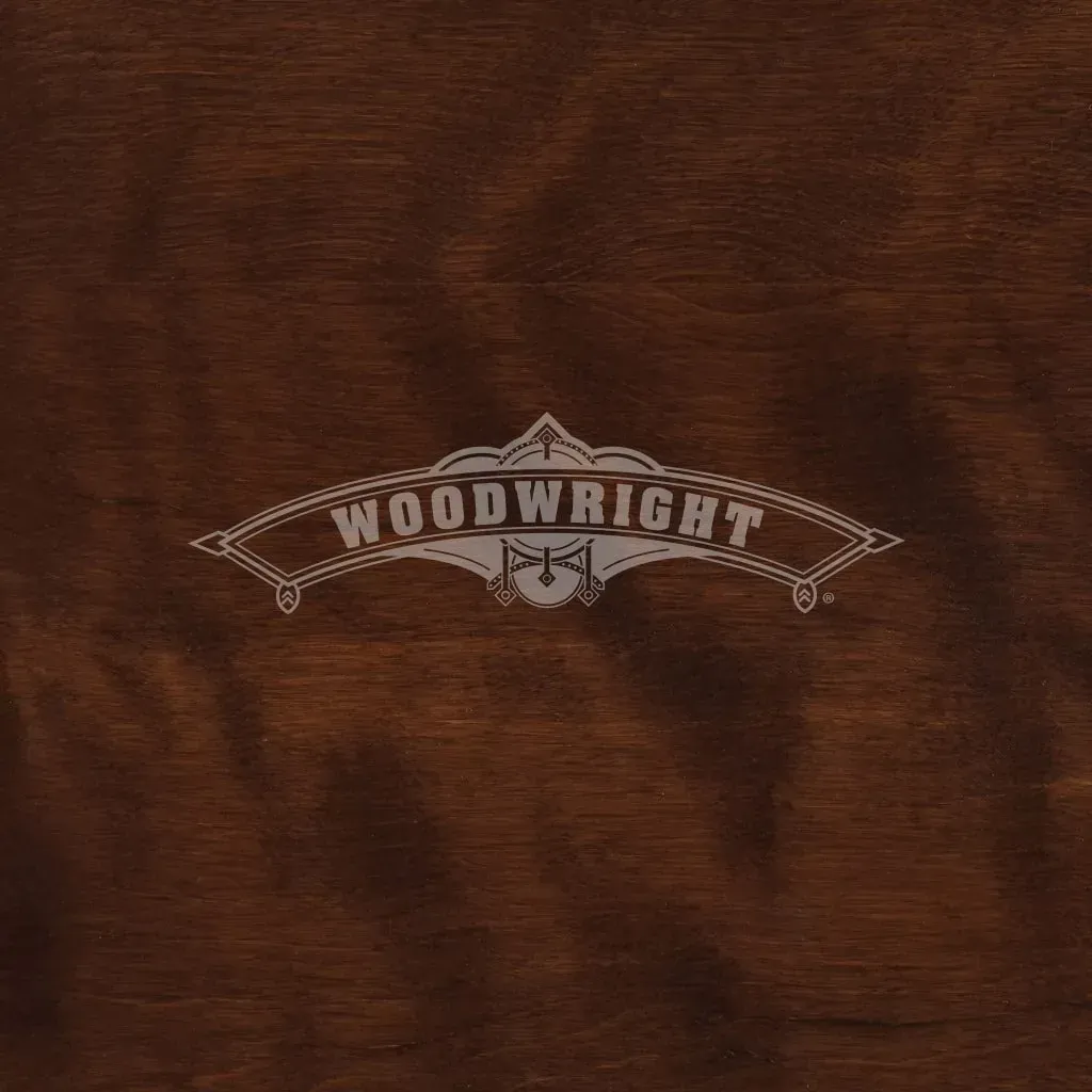 Woodwright logo on a dark brown wood grain surface.
