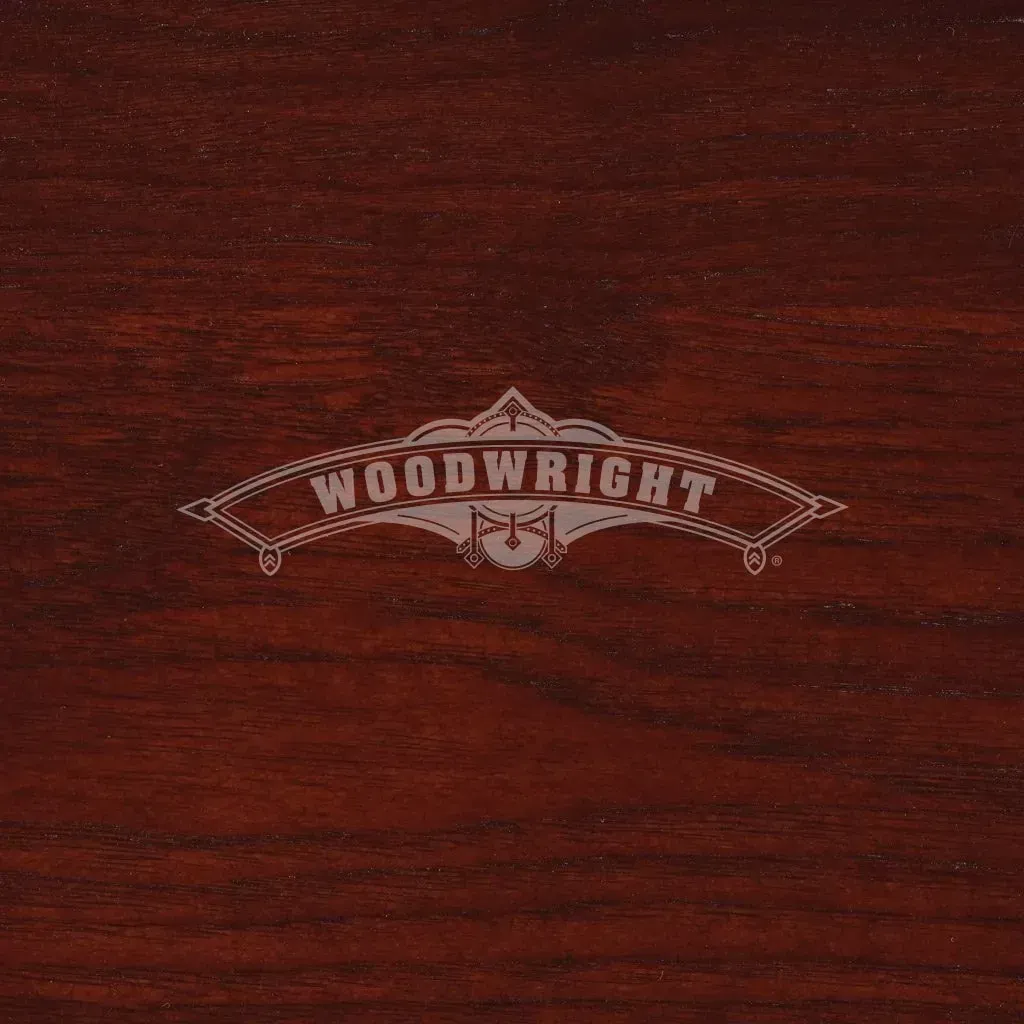 Woodwright logo on dark red wood grain background.
