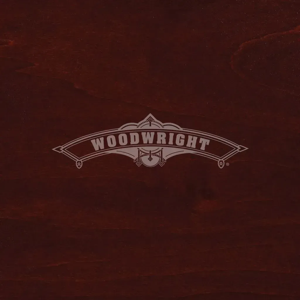 Woodwright logo on a dark wood background.
