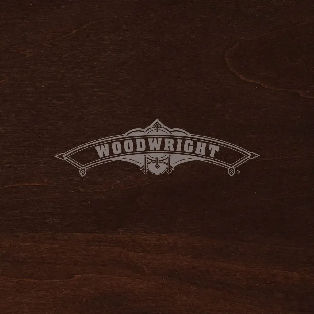 Woodwright logo in silver on a dark wood background.