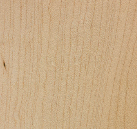 Close-up of a light-colored wood grain, showing vertical lines and natural variations in tone.