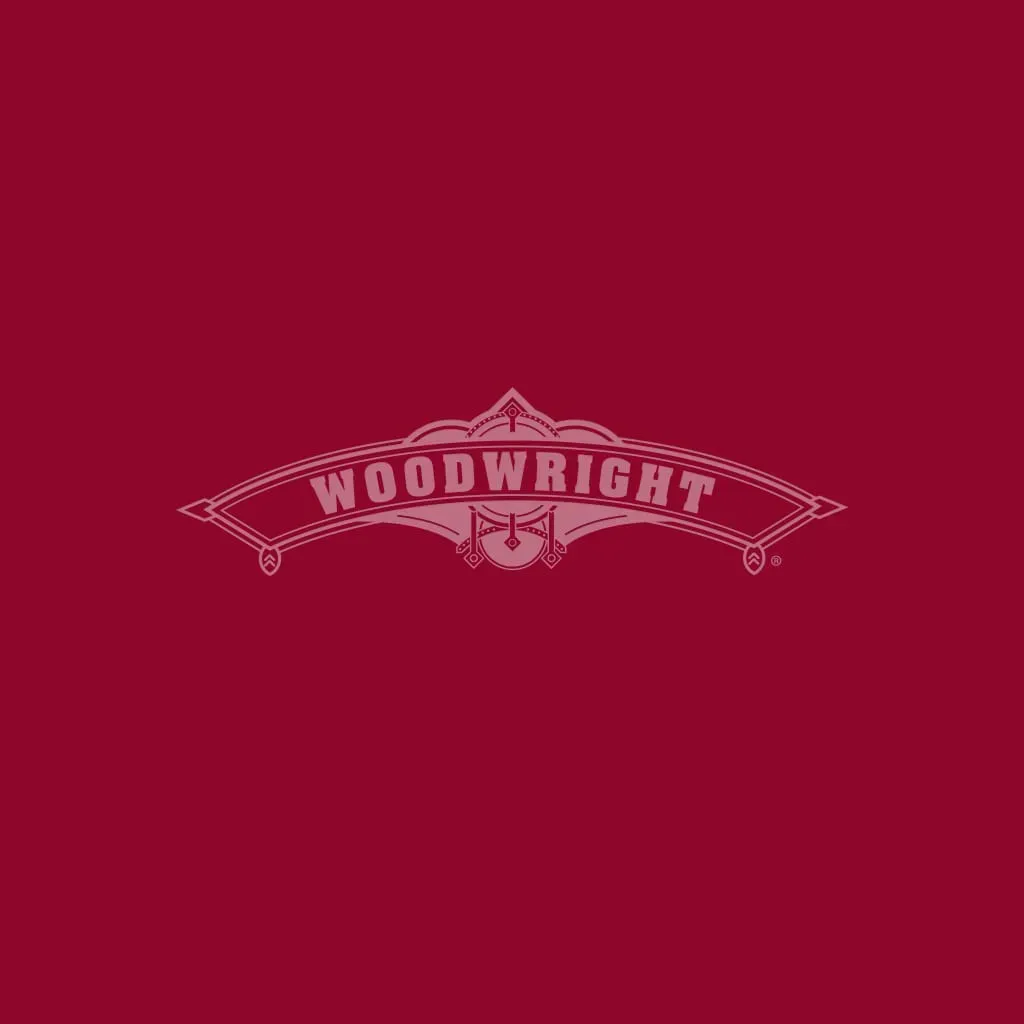 Woodwright logo on a burgundy background.