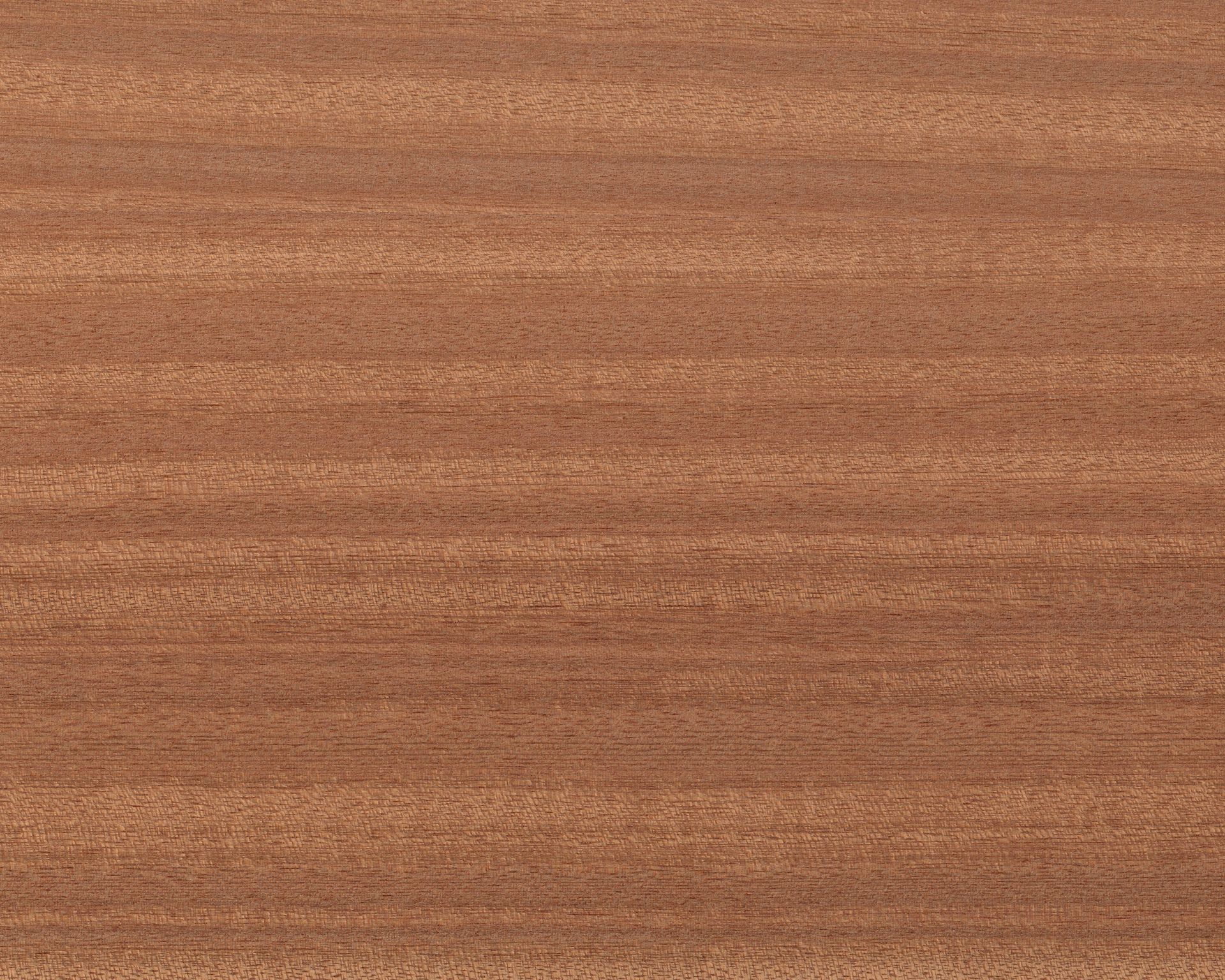Close-up of reddish-brown wood grain with horizontal streaks and subtle speckles.
