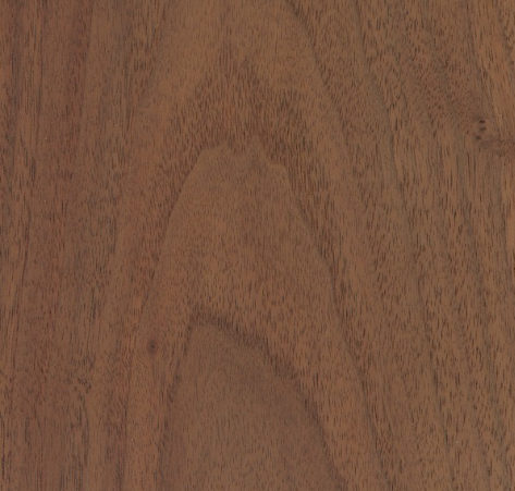Close-up of a brown wood grain, showing variations in tone and texture with vertical grain pattern.