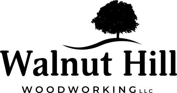 Logo for Walnut Hill Woodworking: text under a silhouette tree and a curved line.