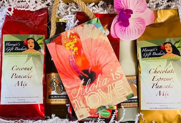 A gift basket with a card that says aloha is love