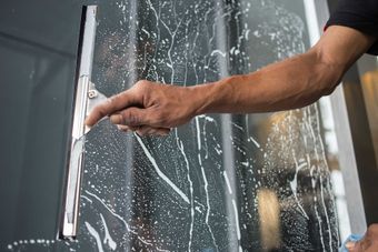 Cleaning windows with a squeegee
