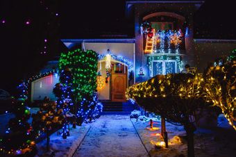 The house is decorated with Christmas holiday lights