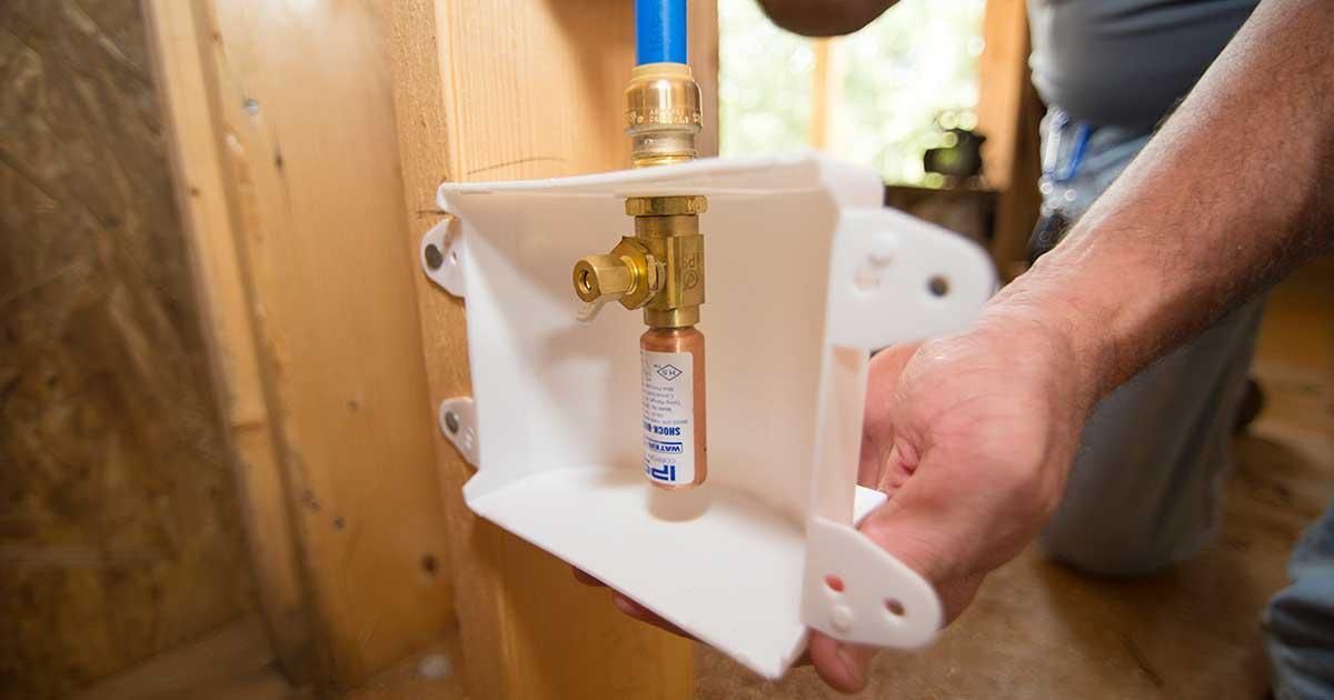 plumber maintaining plumbing system in retail store