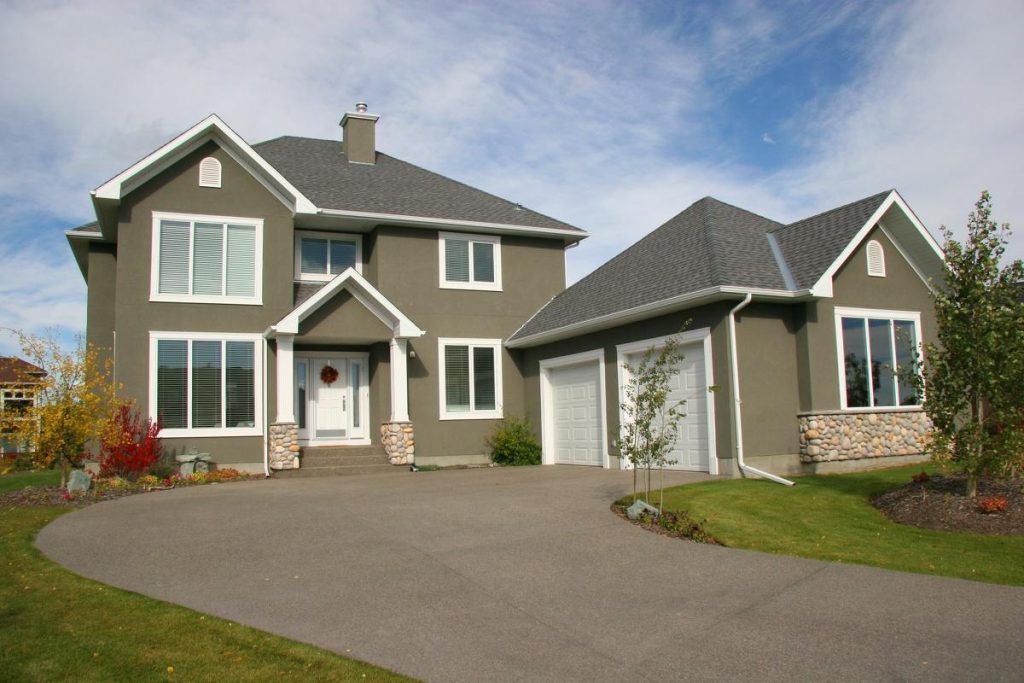 A large house with two garages and a driveway