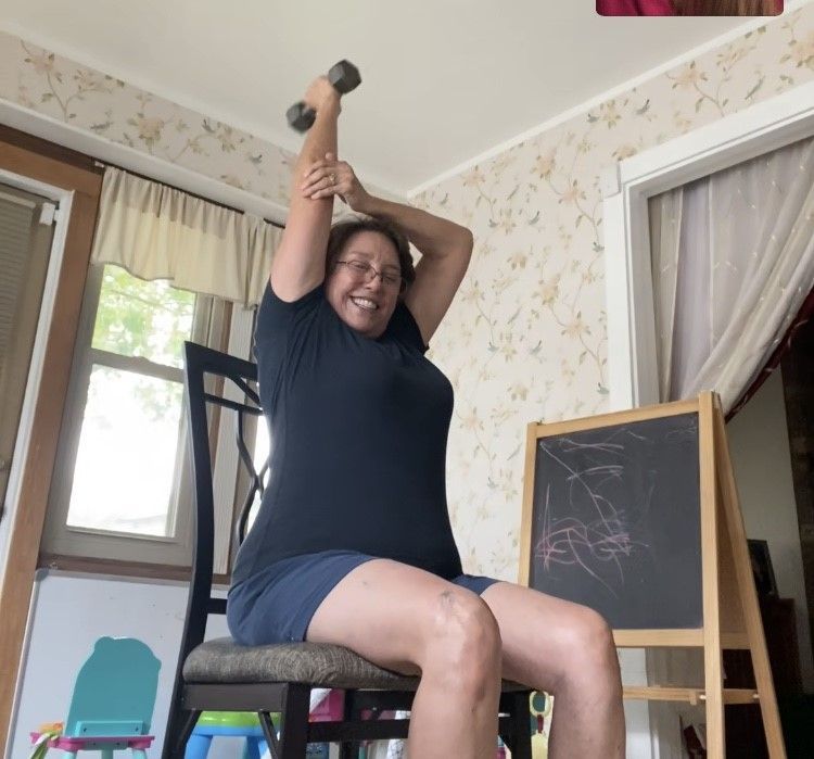 Amelia doing seated Tricep Extentions