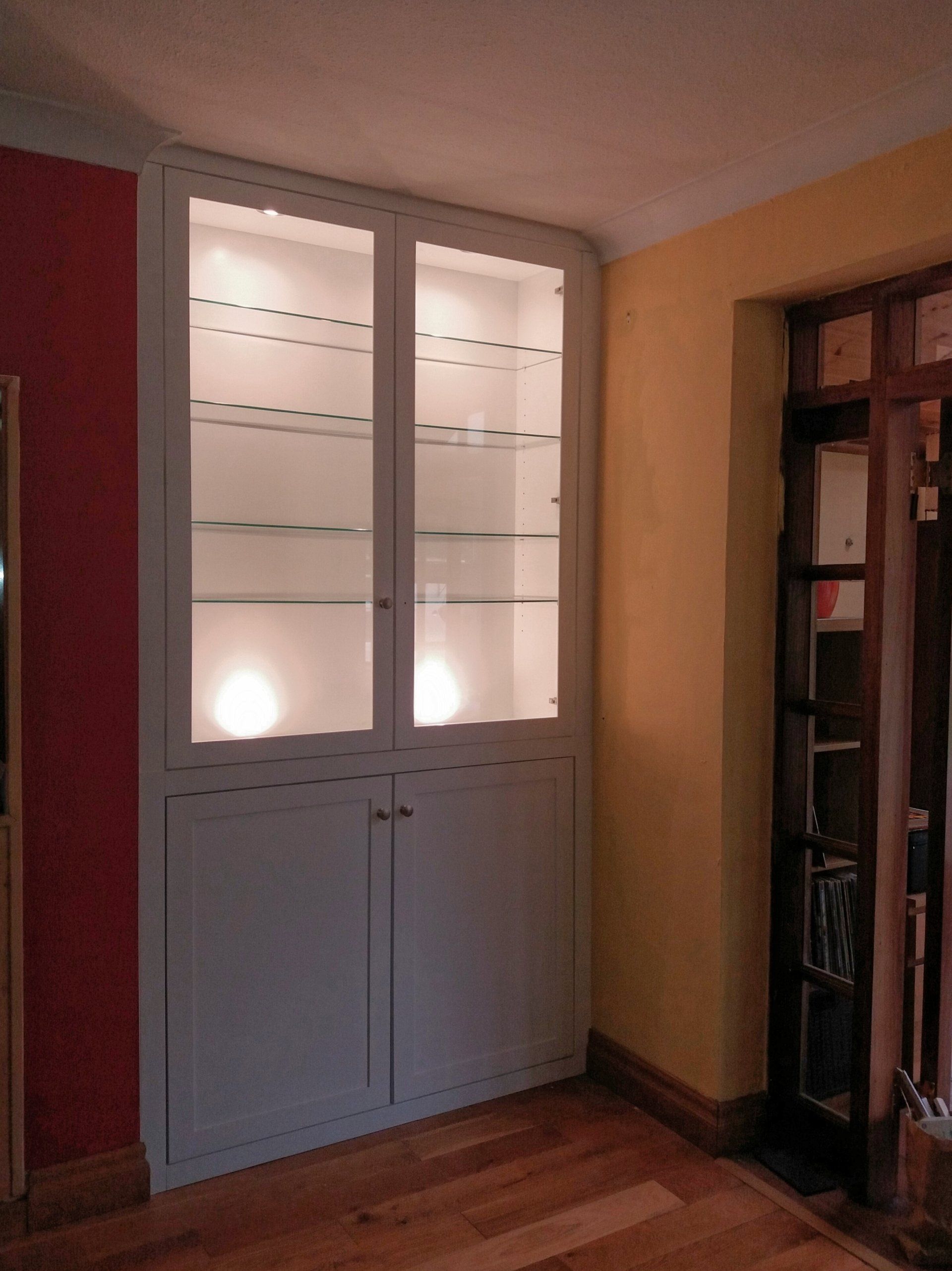 alcove unit with lights and glass
