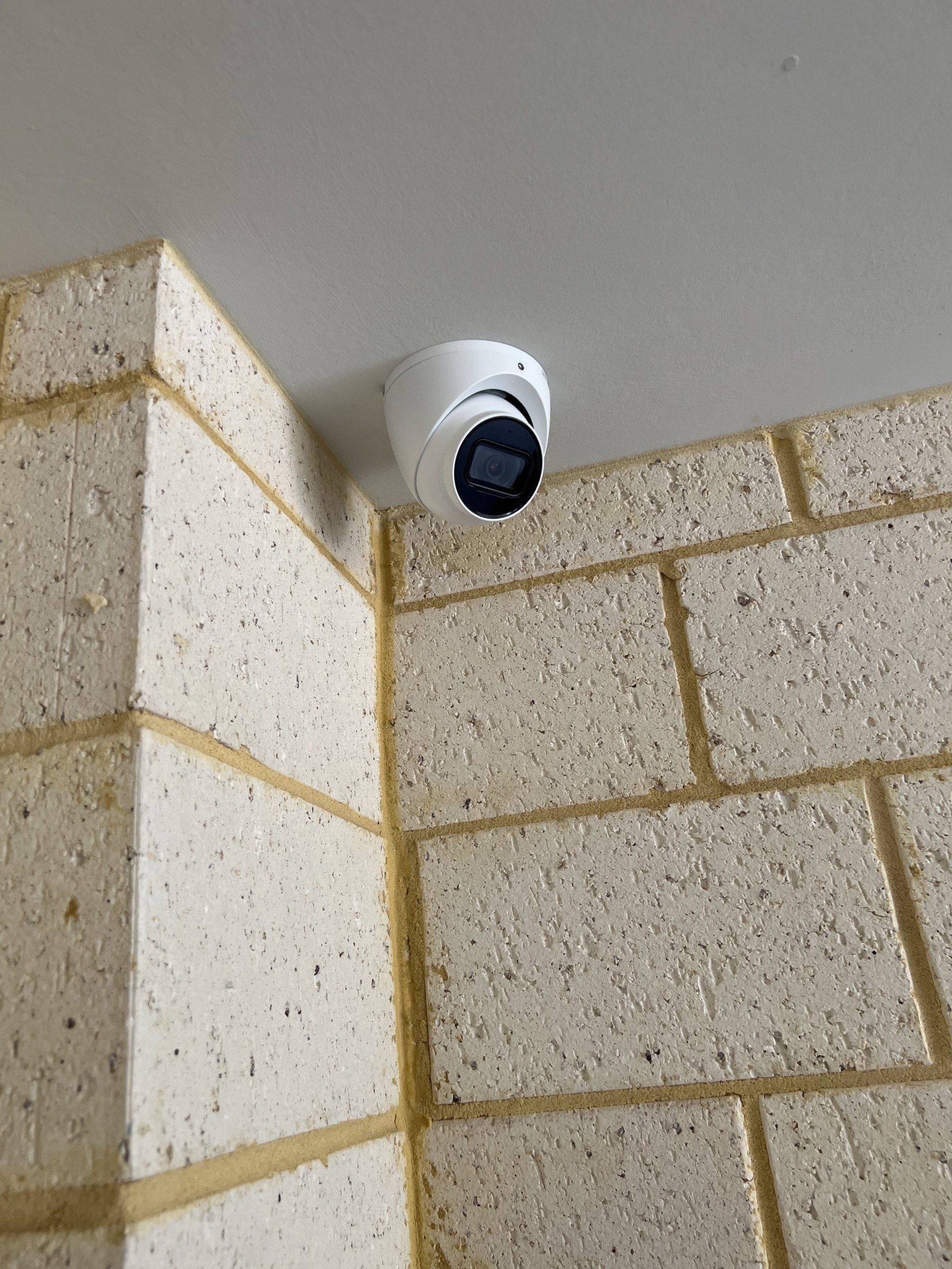 External cctv cameras mounted on the side of a building providing security and proof