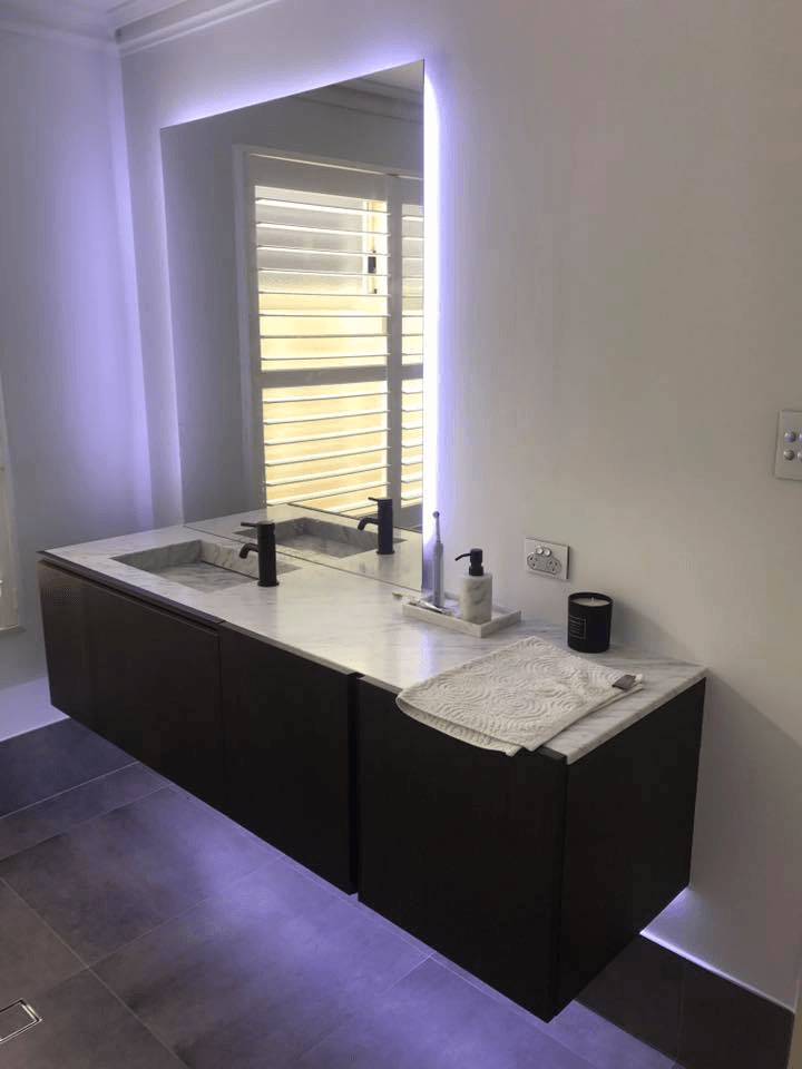LED strip lighting behind bathroom sink