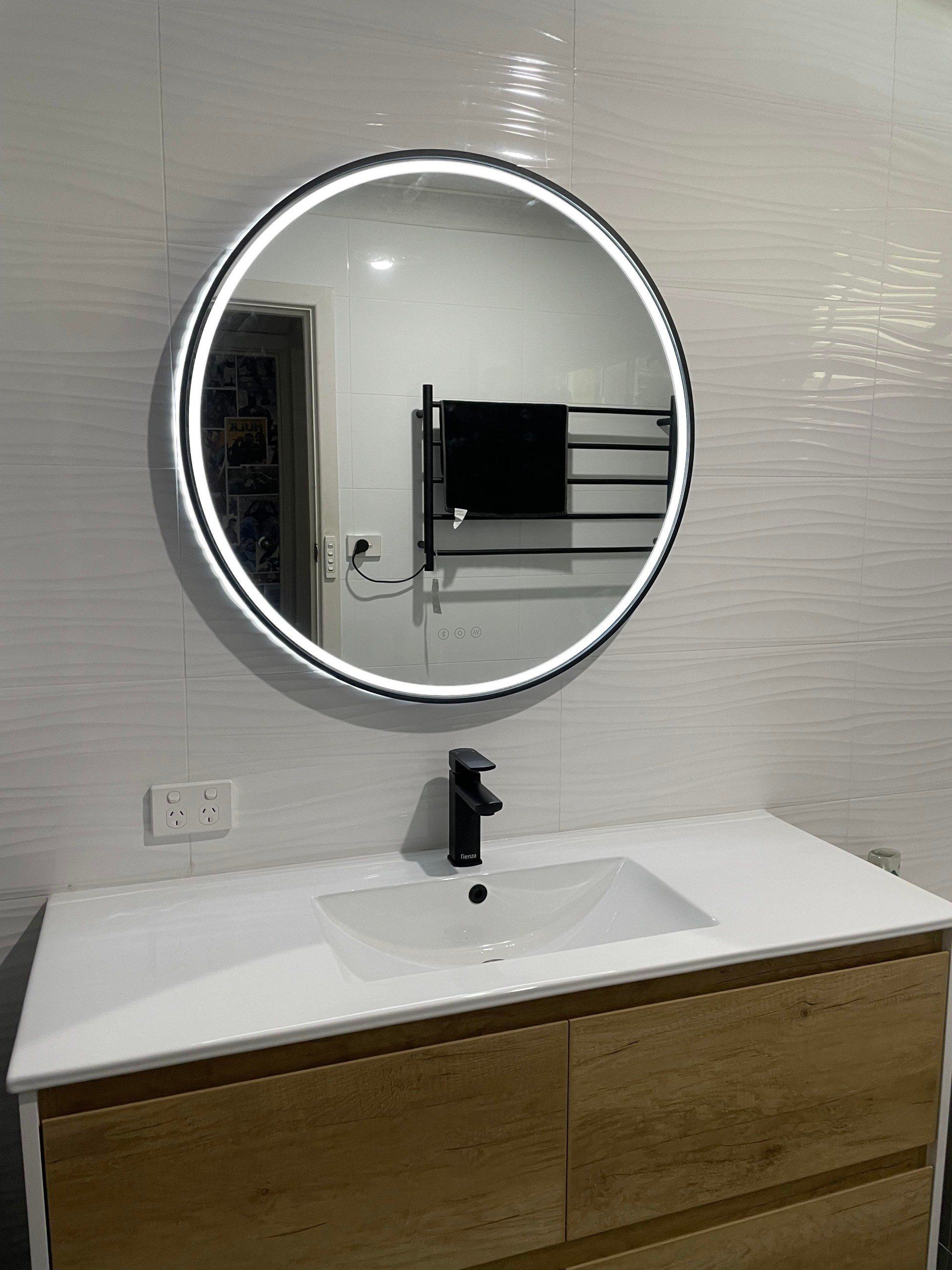 New LED strip lighting installation on bathroom mirror