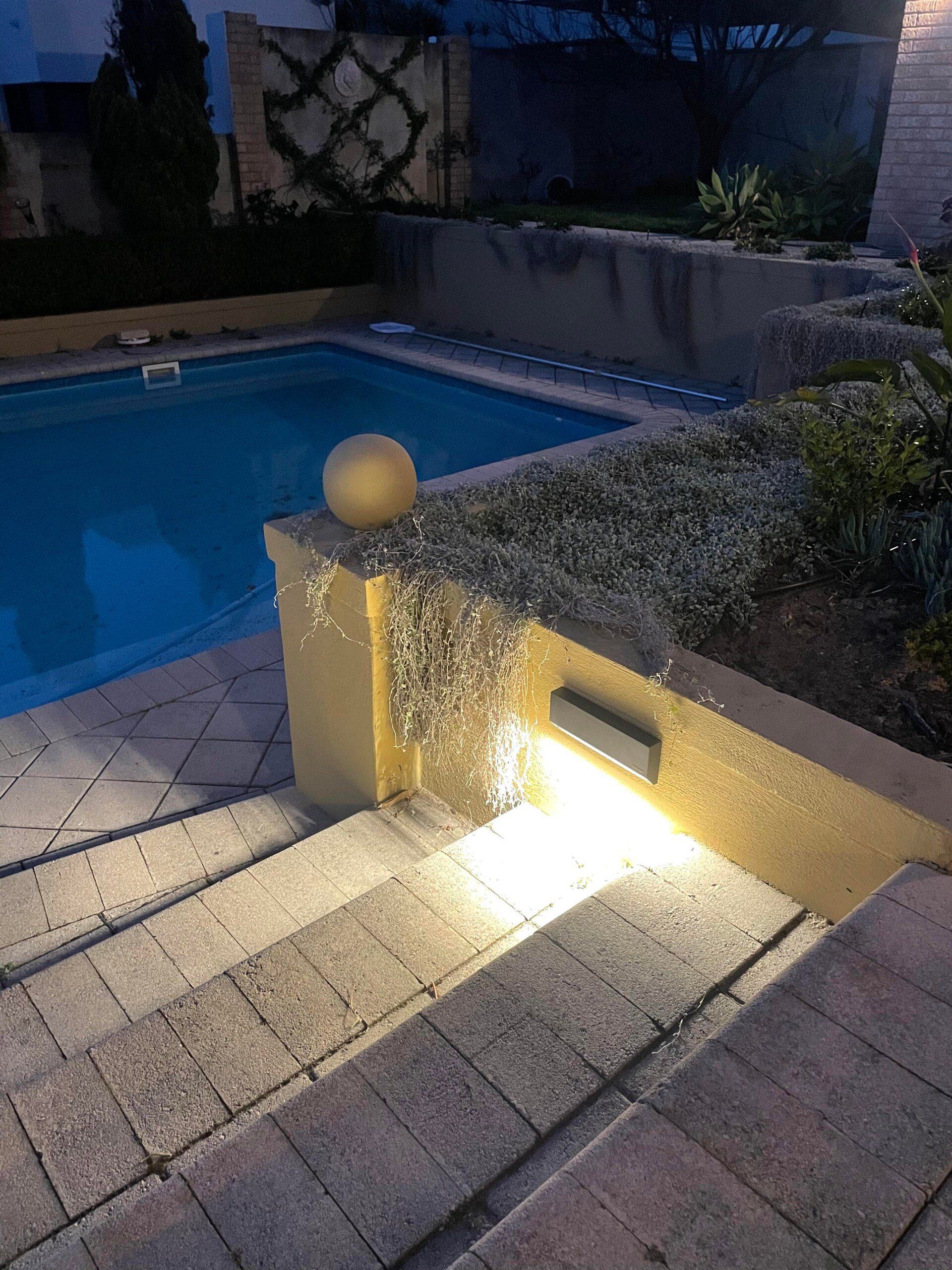 New outdoor lighting installation near the pool