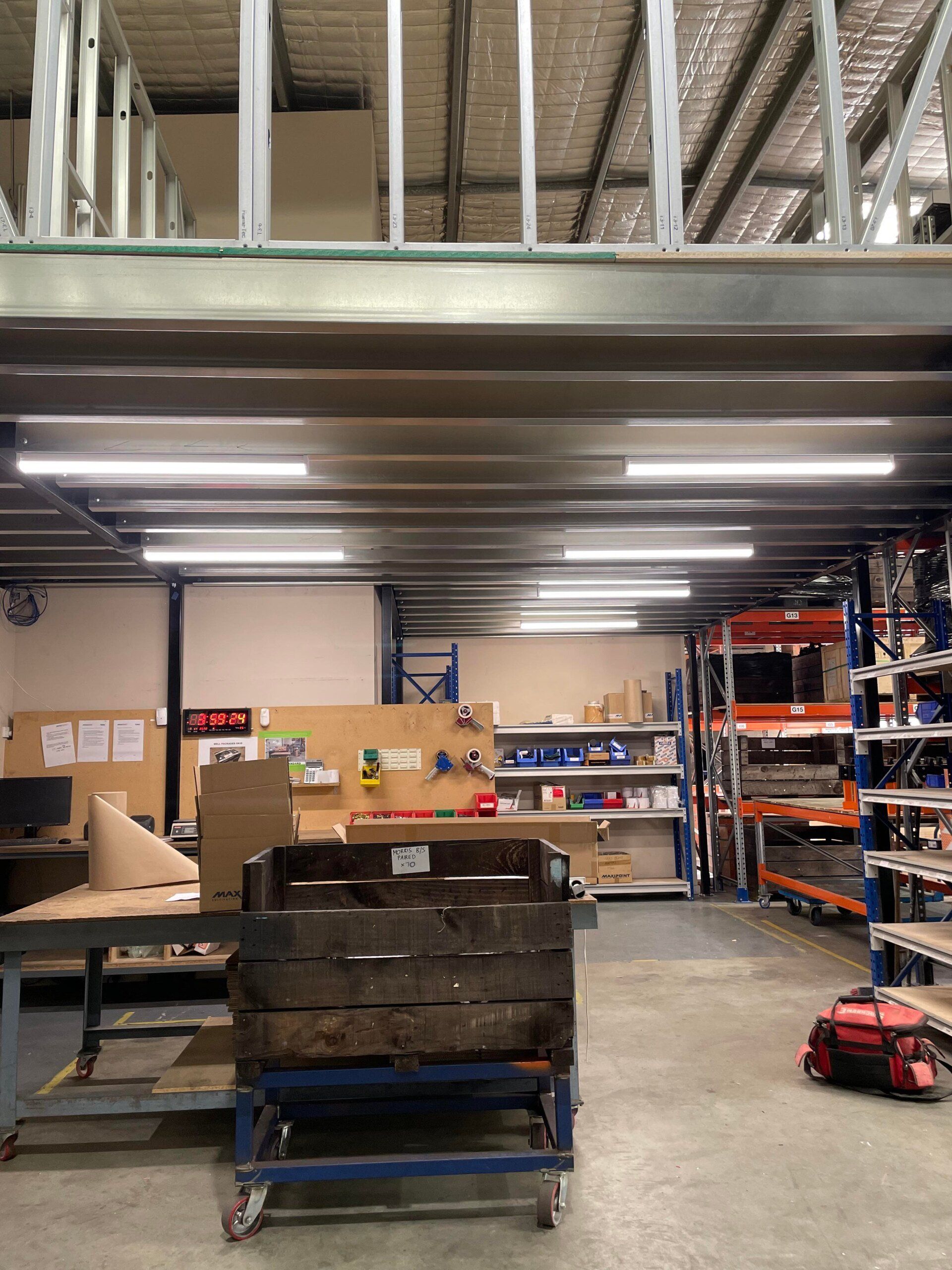 Light installation under mezzanine in a workshop