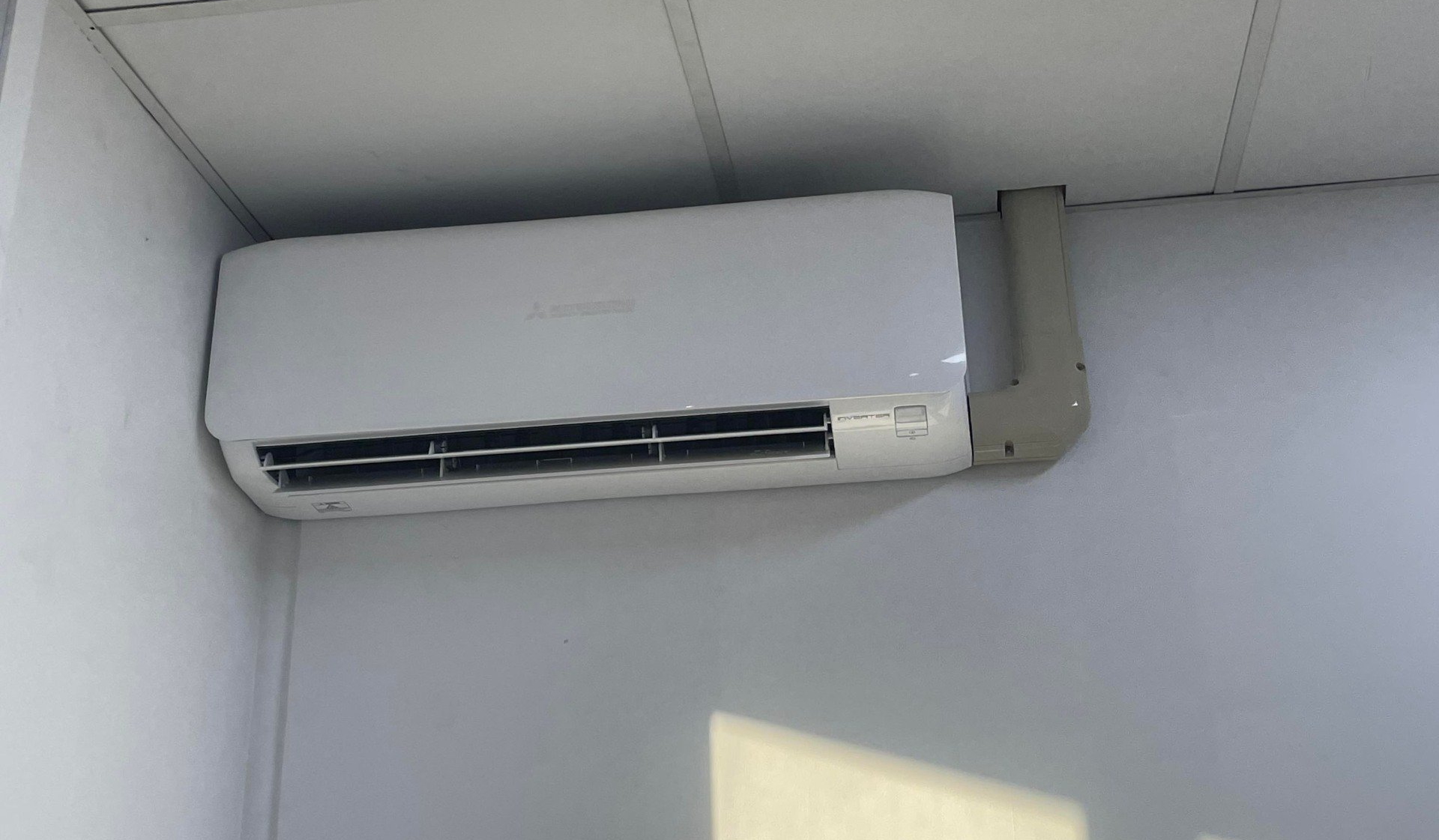 Indoor Split System Air Conditioning Unit Installed in Bedroom