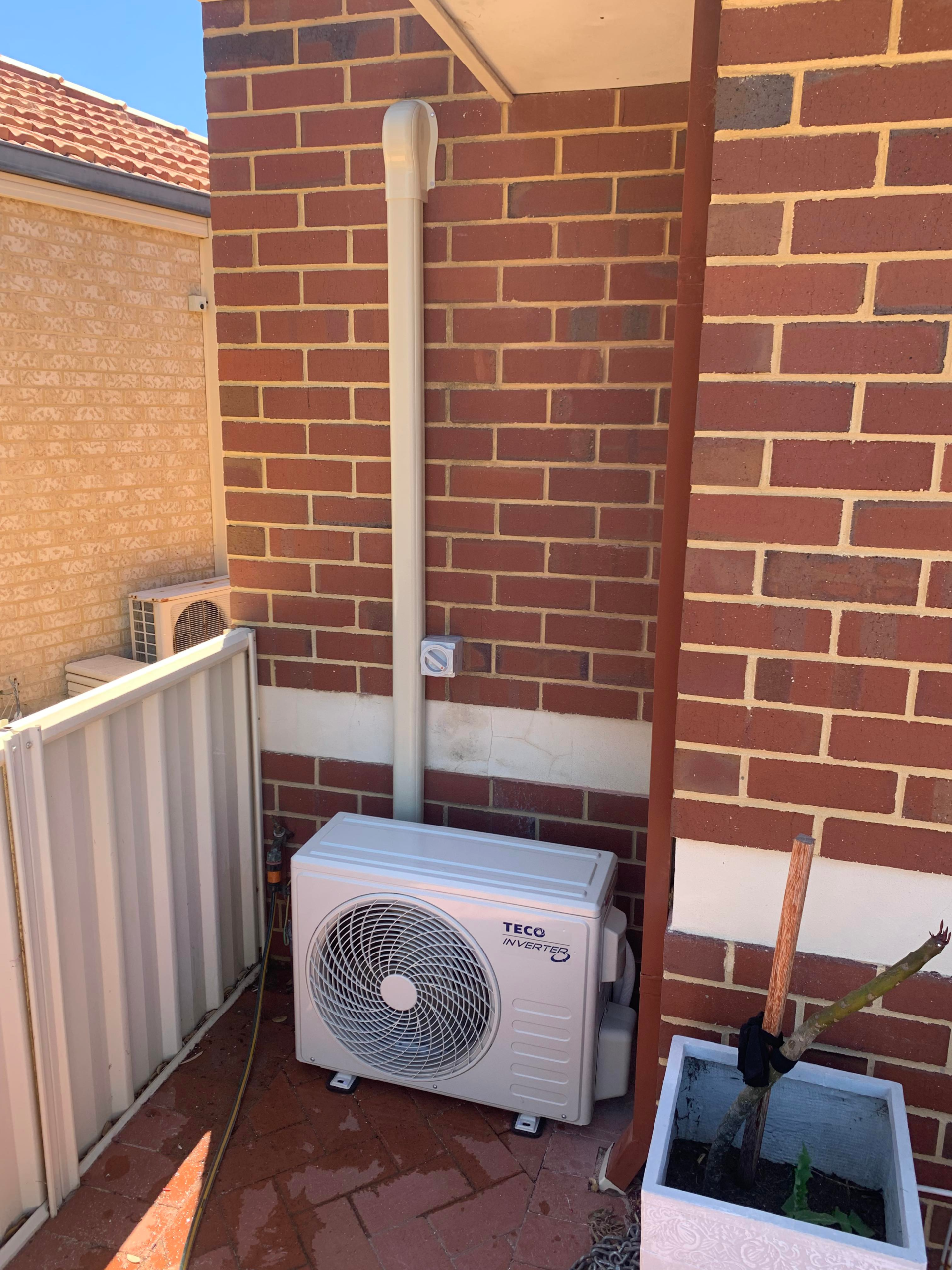 Split system mounted on the floor cooling a Perth residential home for family