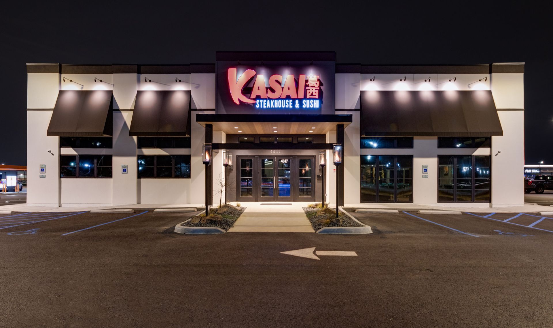 A large building with a sign that says ' kasai ' on it