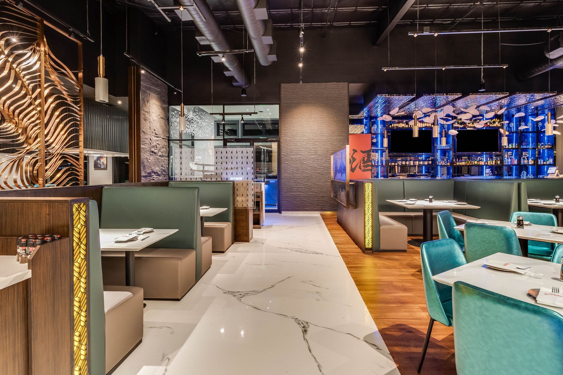 A restaurant with tables and chairs and a marble floor.