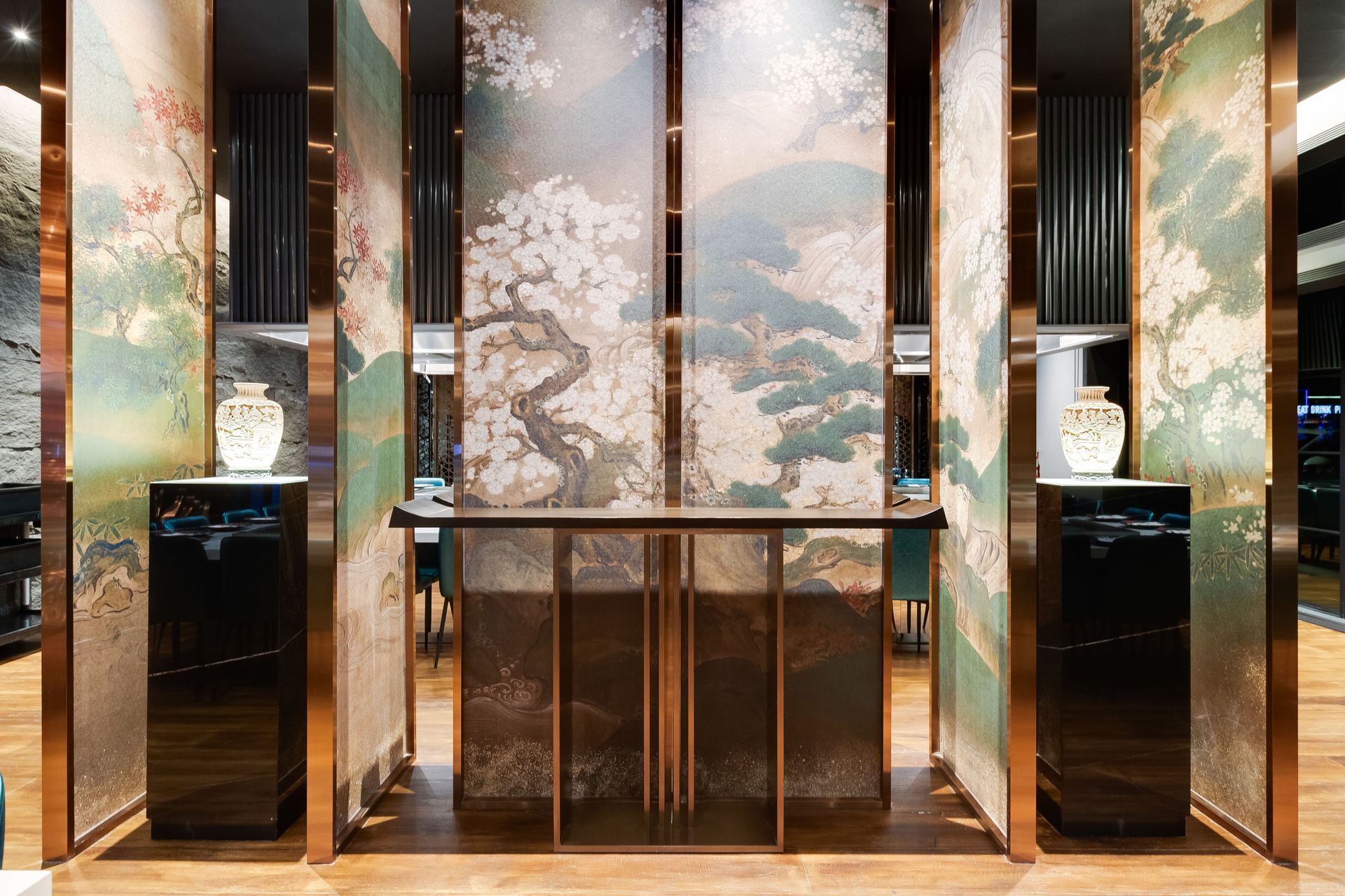 A room with a painting on the wall and a table.