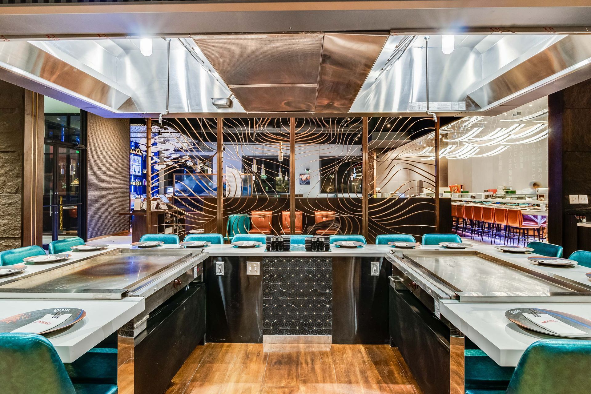 A large room with a lot of tables and chairs in a restaurant.