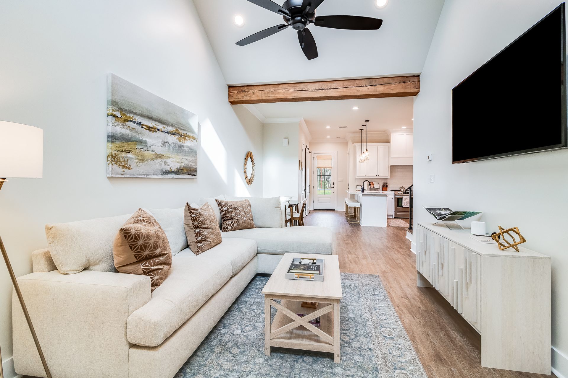 A living room with a couch and a flat screen tv