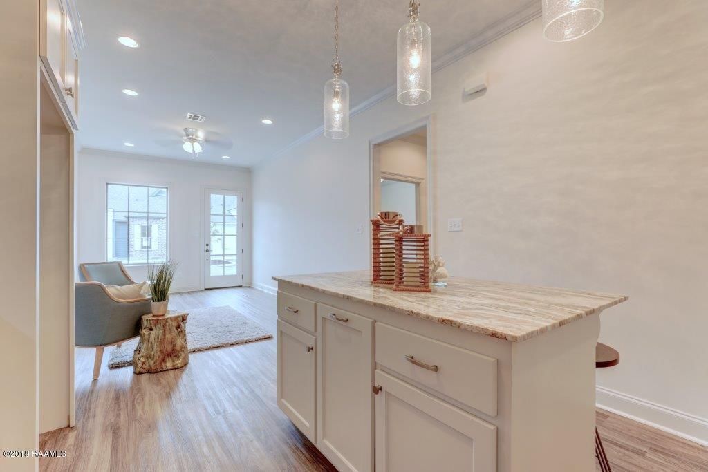 A kitchen with a large island in the middle of the room.