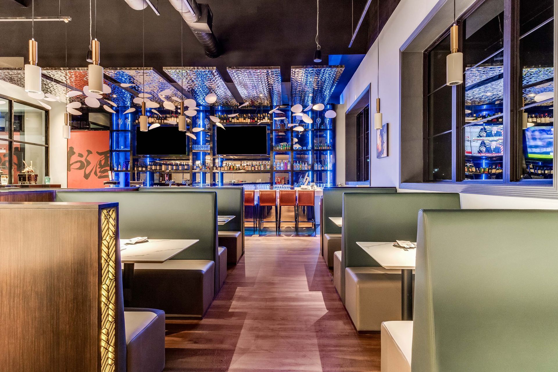 A restaurant with a lot of booths and tables