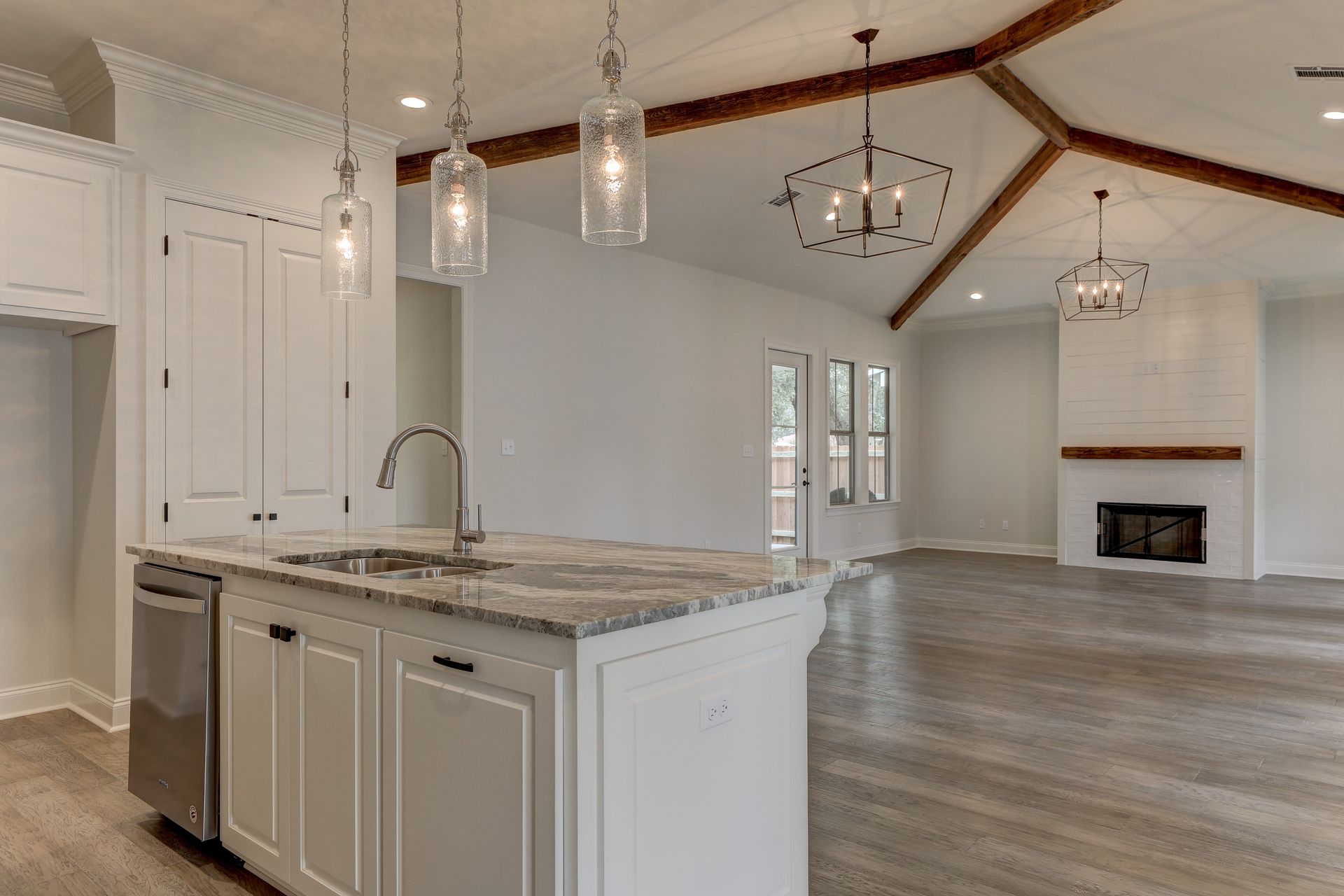 A kitchen with a large island in the middle of the room.