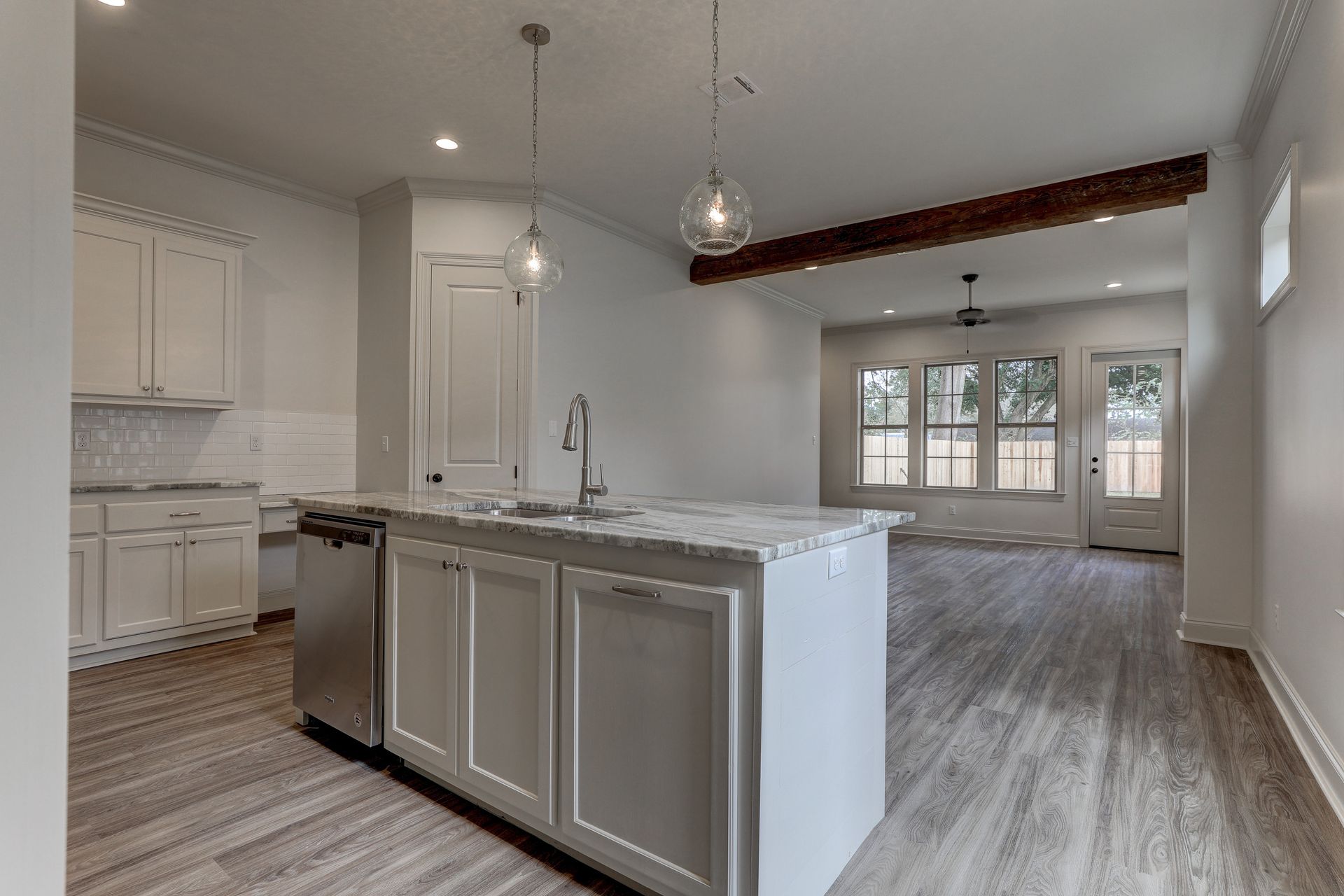 There is a large island in the middle of the kitchen.