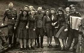 A group of people are posing for a picture on a bridge.