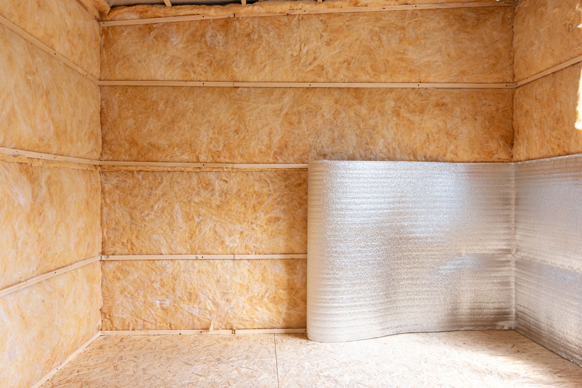 An empty room with a lot of insulation on the walls.