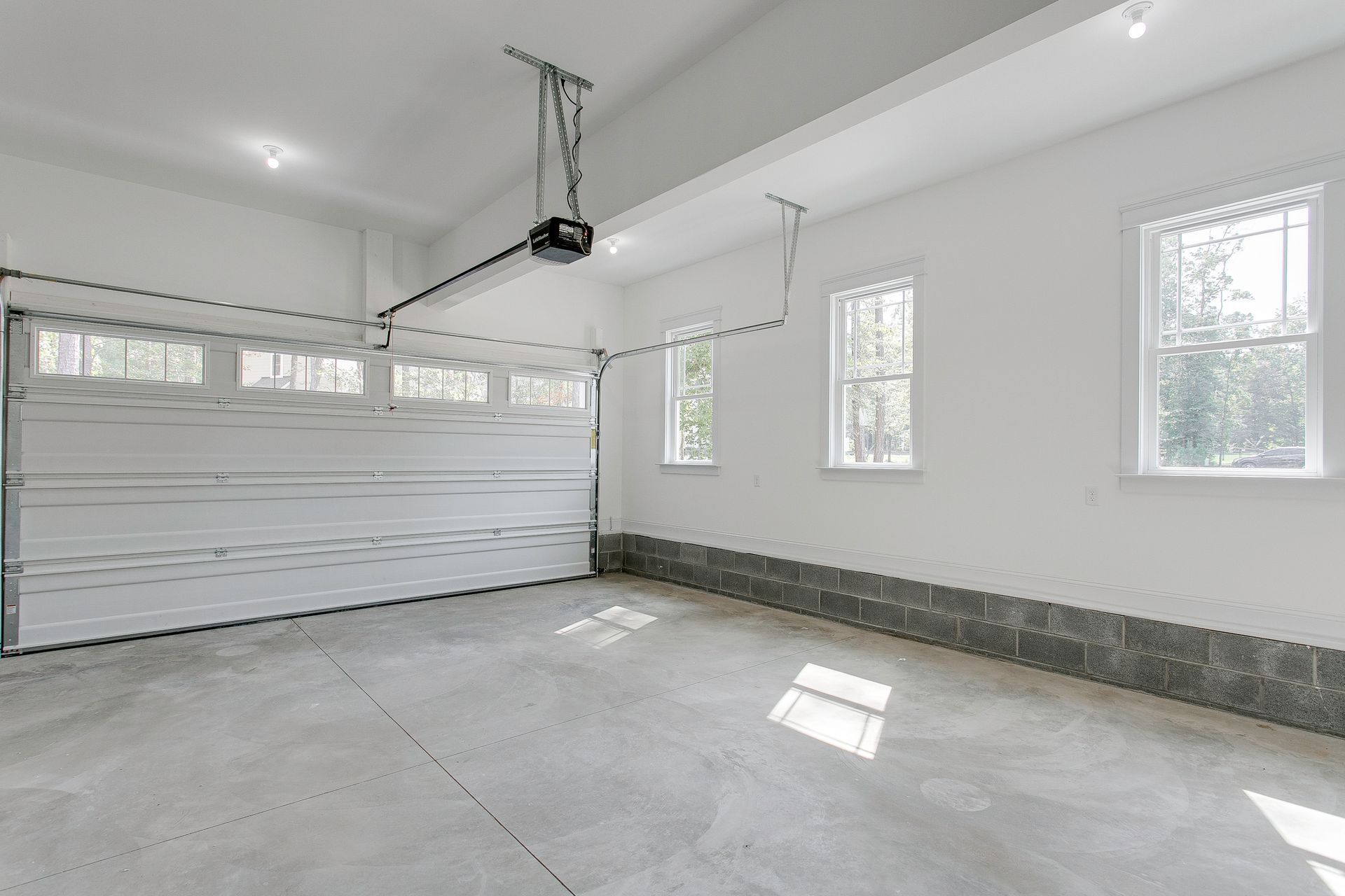 Bright garage space showcasing property cleanout services with open double doors