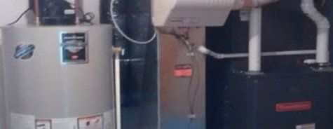 Un chauffe-eau et un climatiseur sont au sous-sol.