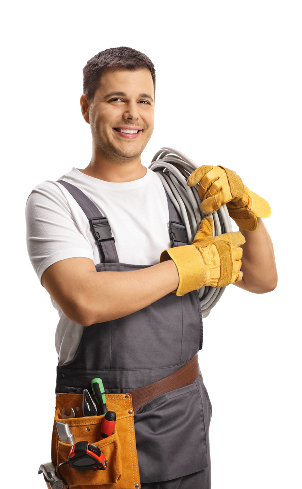 A man in overalls is holding a hose and smiling.