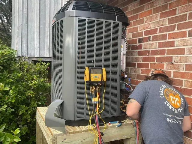 HVAC technician repairing an air conditioning unit