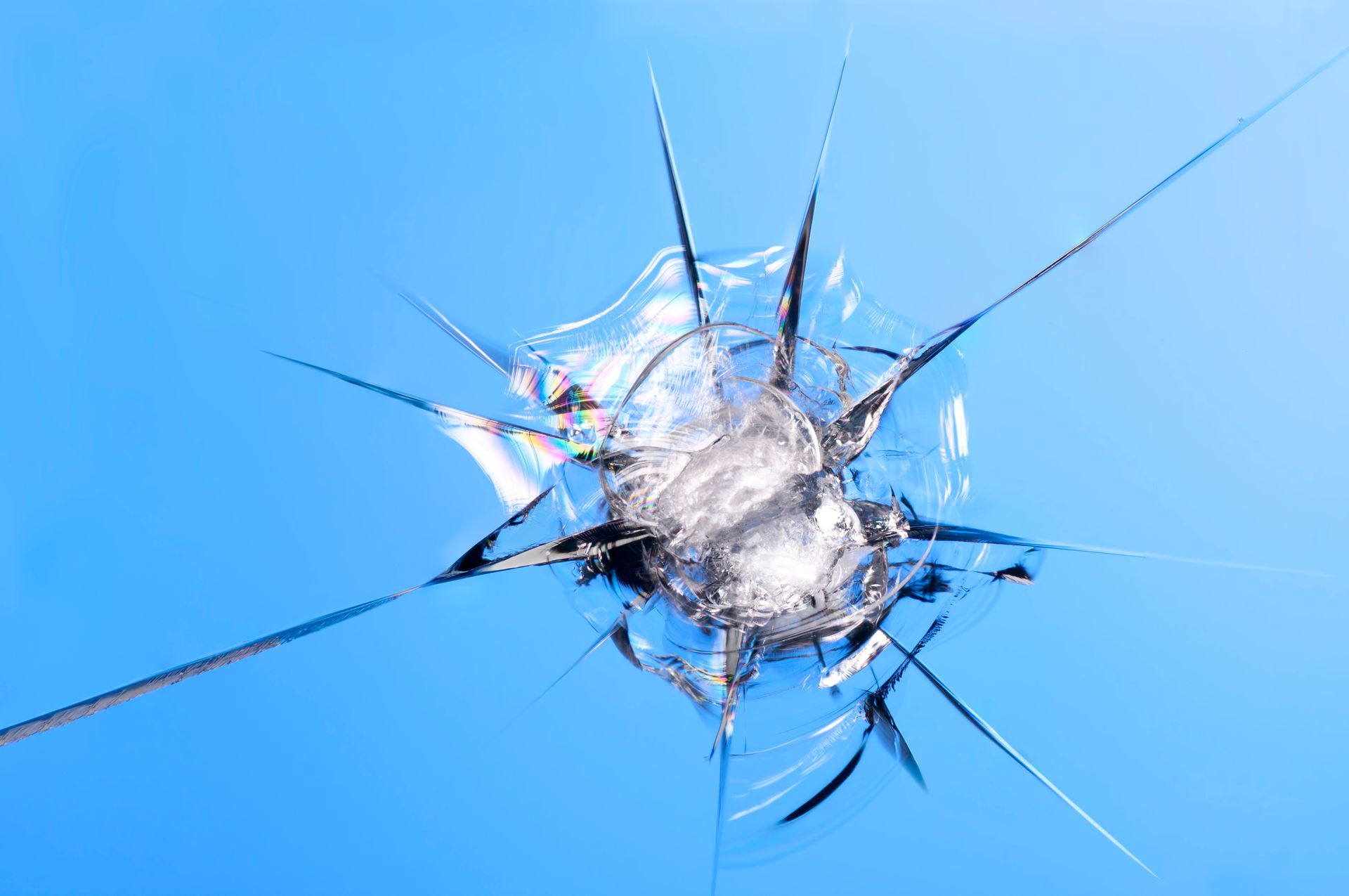 A close up of a broken windshield with a hole in it - Seagrove, NC - Seagrove Glass Shop