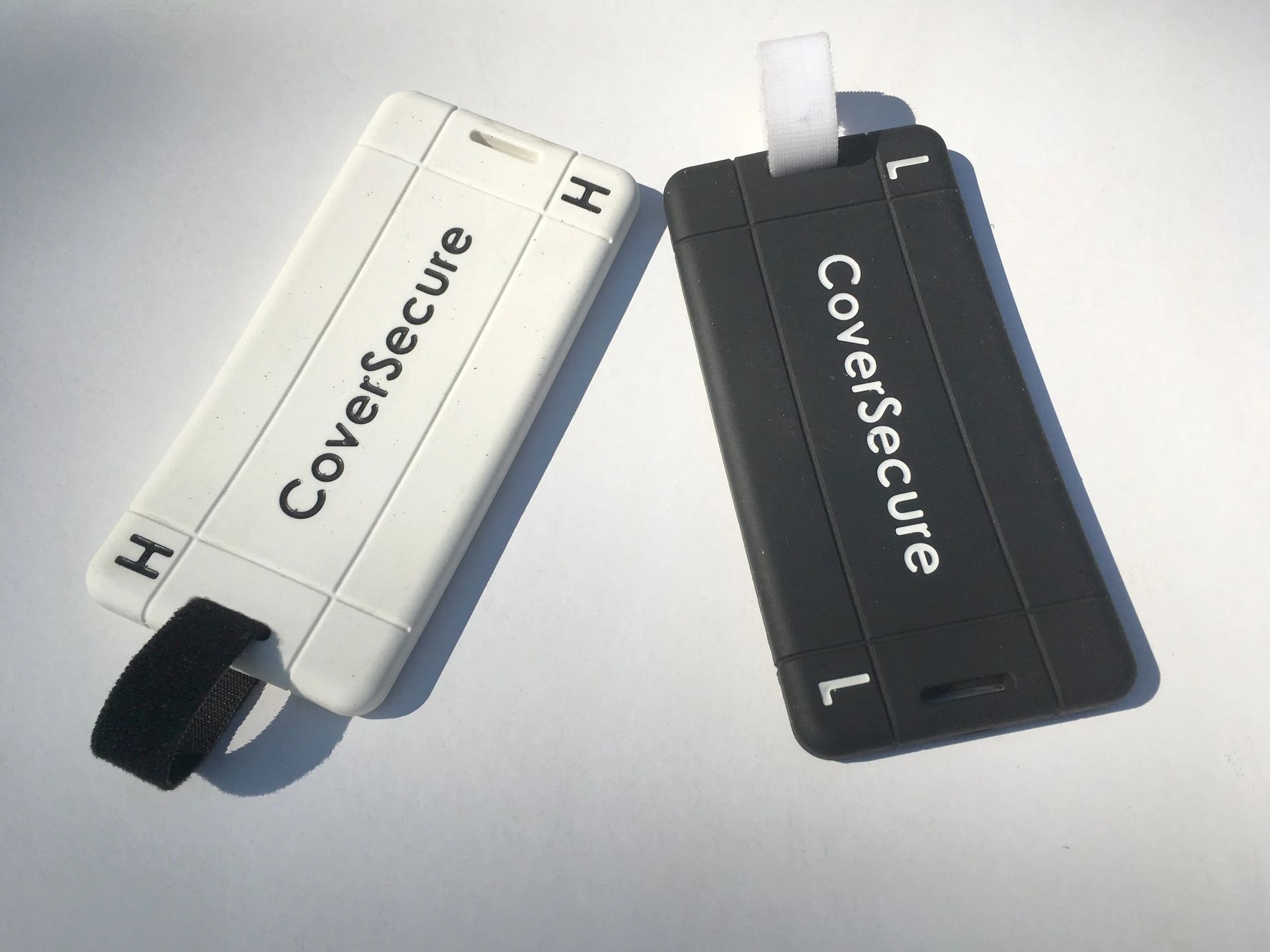 white and black cover secure products side by side